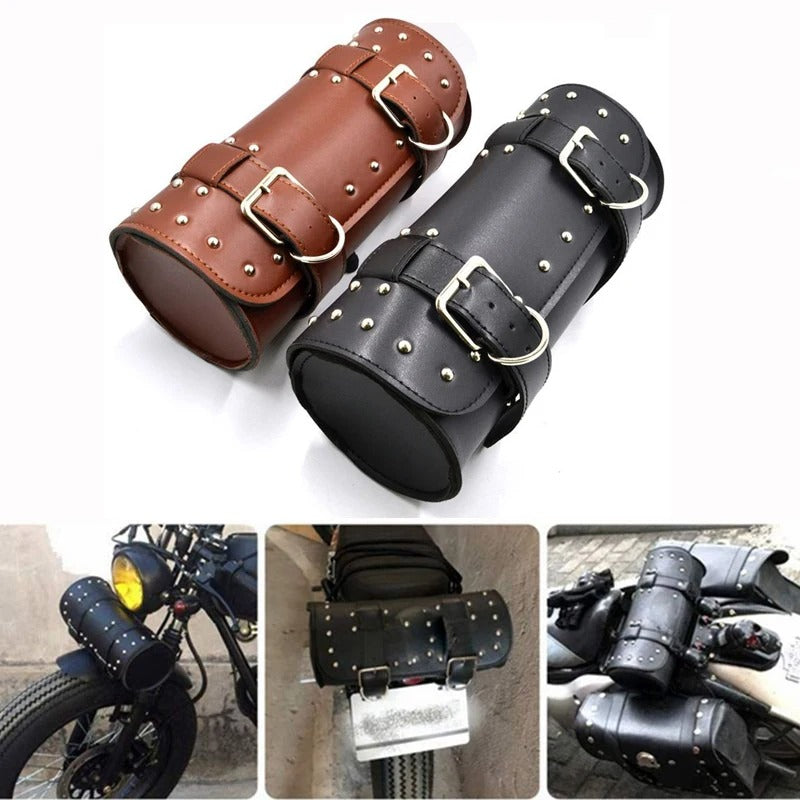 Black and brown leather motorcycle saddlebags with studs and buckles on a white background.