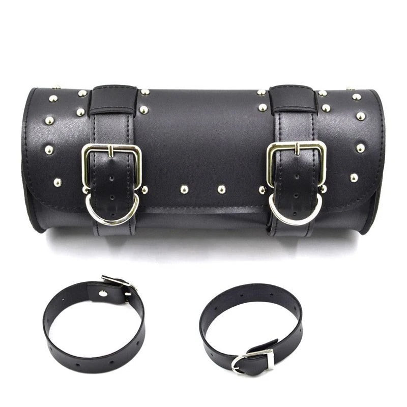 Black leather roll with silver studs and buckles on a white background